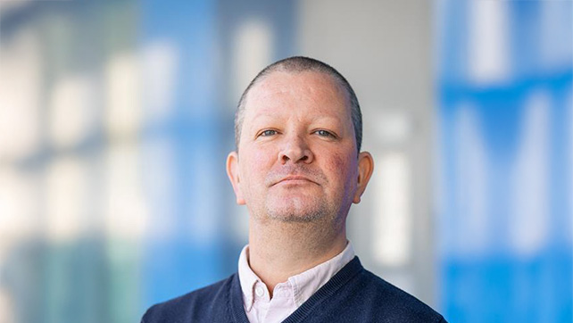 A headshot of Dr Craig Webber