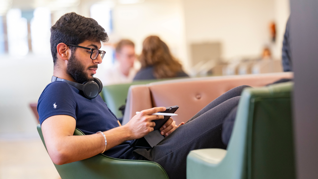 Male Southampton student working on a tablet