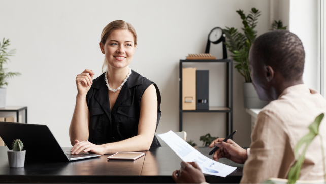 Professional woman smiling in a business meeting