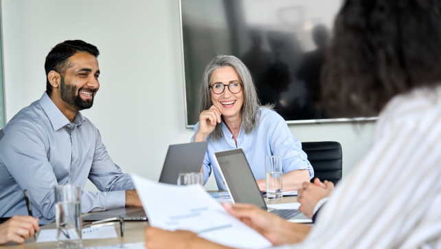 Woman smiling in a meeting