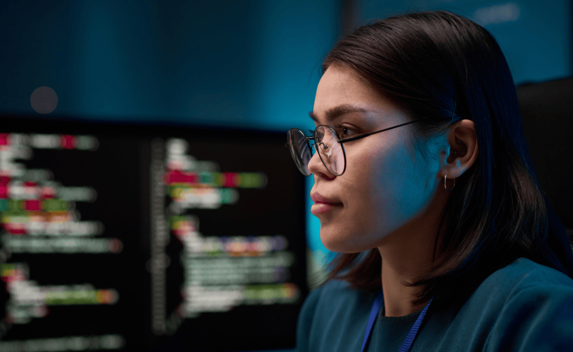 Thoughtful woman working on code