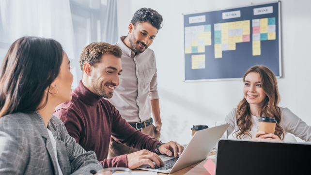 Four marketers having a discussion in a meeting