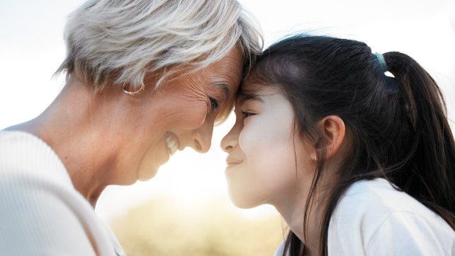 Older adult and child sharing a joyful moment